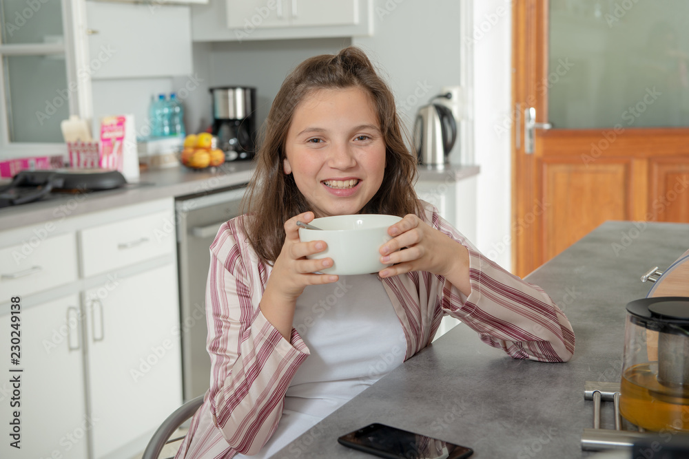 morning, teenage girl is drinking coffee in a bowl morning, teenage girl is drinking coffee in a bowl