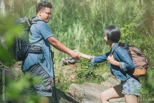 adventure, travel, tourism, hike concept , Smiling couple walking with backpacks outdoors. © Sirichai