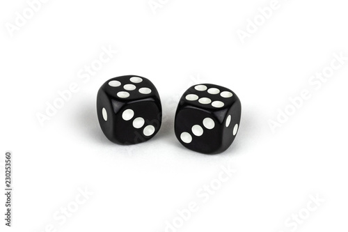 Two black dice isolated on a white background. Five and six