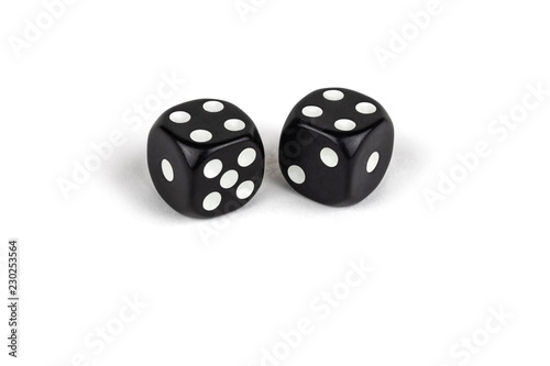 Two black dice isolated on a white background. Four and four