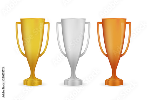 Realistic award winner cups. Golden, silver and bronze trophy set. Vector illustration.