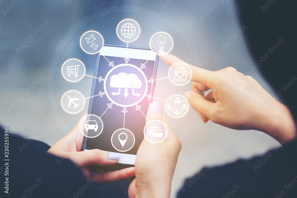 Internet of Things (IoT), Woman using smartphone and iot icon or hologram, Communication network service and Business concept Internet of Things (IoT), Woman using smartphone and iot icon or hologram, Communication network service and Business concept
