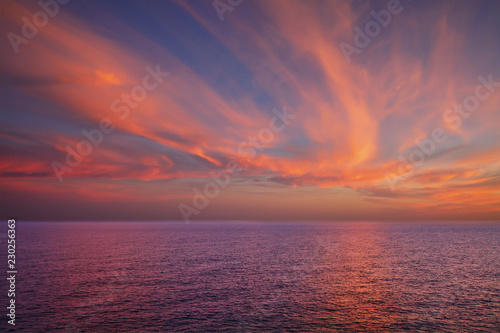 Dramatic sunset over sea surface  outdoor background