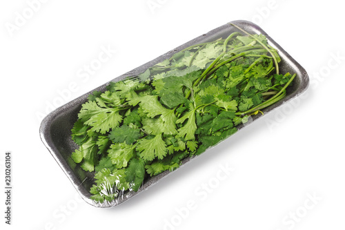 Bunch of cilantro in food tray