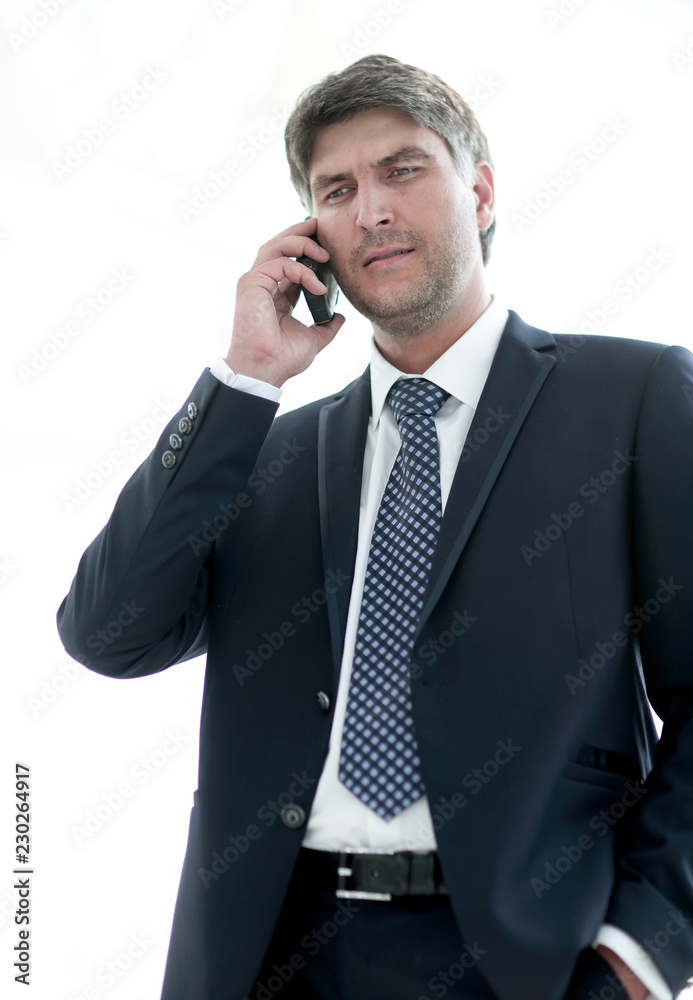 Confident businessman talking on the phone. Confident businessman talking on the phone.