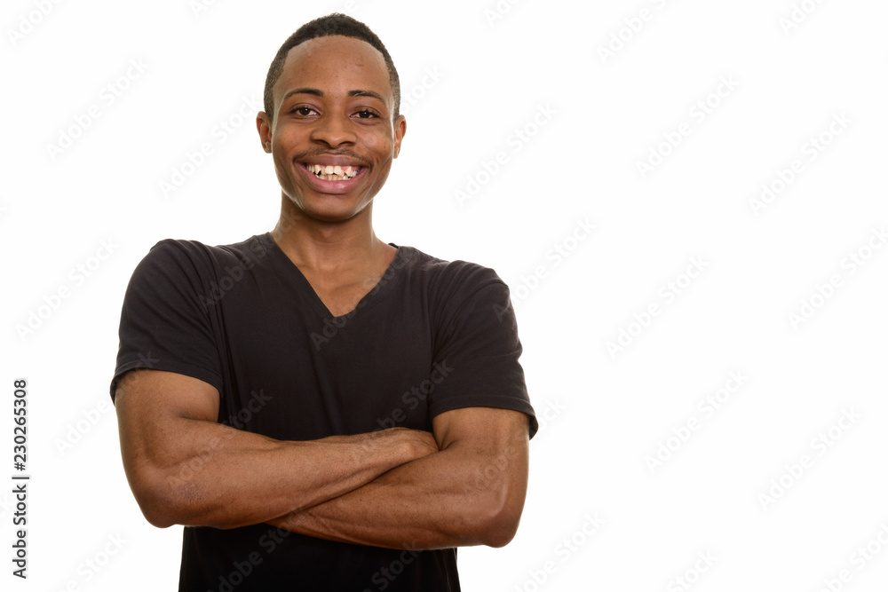 Handsome happy African man smiling with arms crossed isolated against white background Handsome happy African man smiling with arms crossed isolated against white background