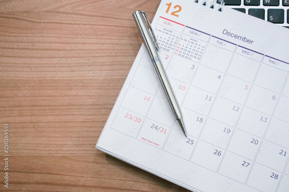 close up silver pen lay on calendar schedule for note or make appointment concept.
close up silver pen lay on calendar schedule for note or make appointment concept.