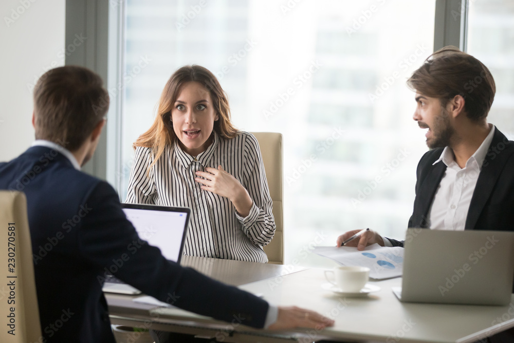 Angry man shouting at indignant shocked female colleague, blaming for ...