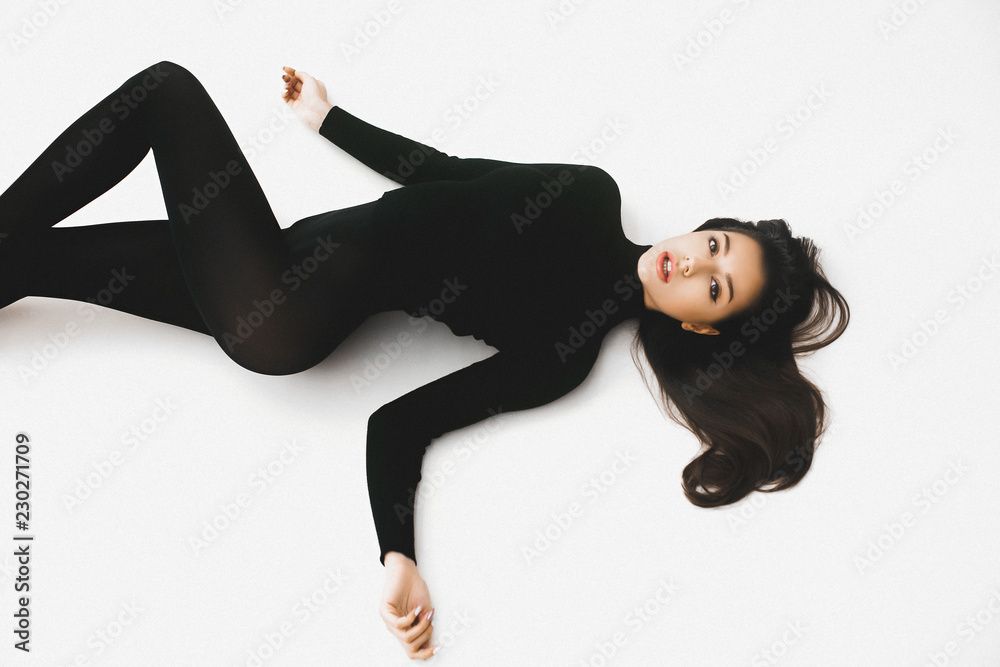 Young elegant girl posing in black pantinos and black sweater Young elegant girl posing in black pantinos and black sweater