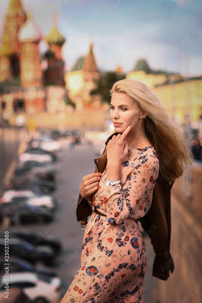 Naklejka premium blond fashion model russian girl close up photo on red square background