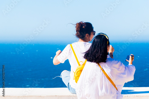 Girls and Lighthouse of Cap Spartel close to Tanger city and Gibraltar in Morocco, Africa