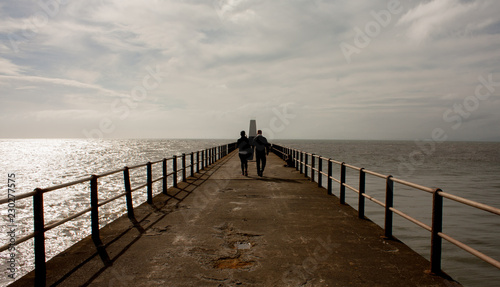 Couple Walking on Promenade 