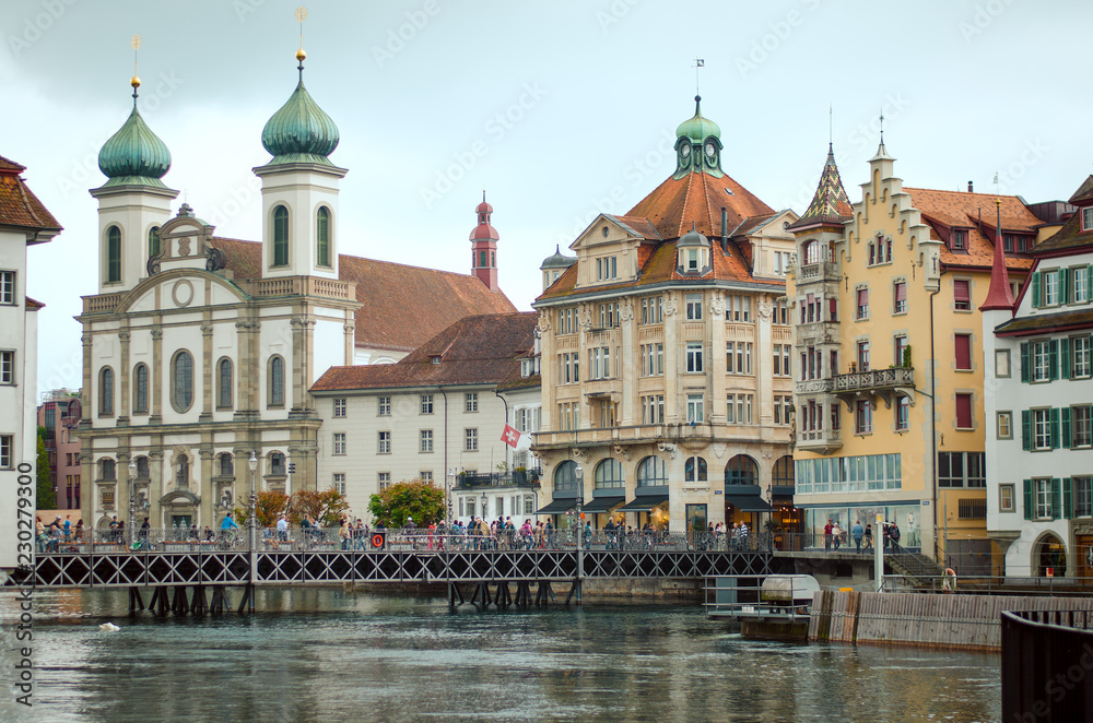 Historic city center of Luzern, church and Reuss river, Switzerland