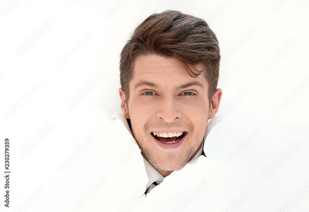 smiling businessman breaks through the paper. smiling businessman breaks through the paper.