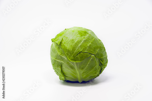 Green cabbage head isolated on white background.