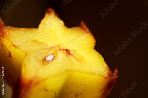 Carambola  star fruit isolated on dark background