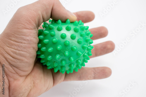 Expander, for hands, studded, rubber on a white background