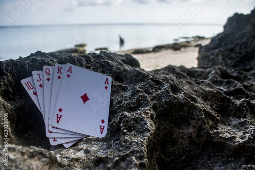 diamond royal flush poker card gamble beach theme