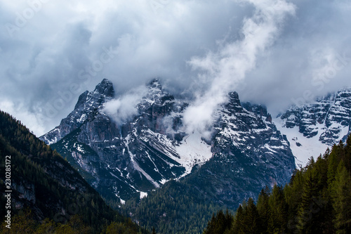Great nature of Italian Dolomites. Lakes mountains and clouds