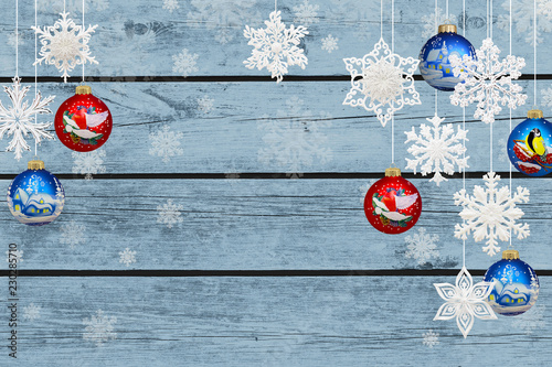 фотографія Christmas and New Year decorations: snowflakes and christmas balls on blue wooden background