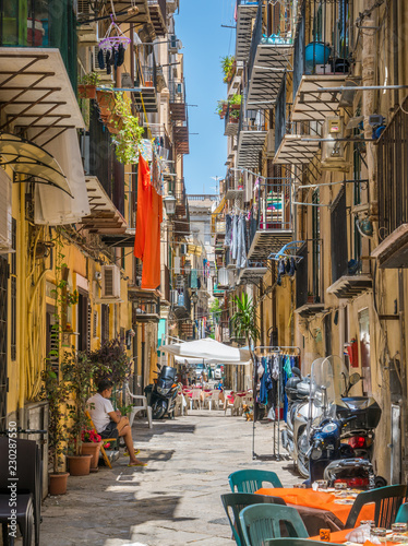A cozy and narrow road in Palermo old town. Sicily, southern Italy.