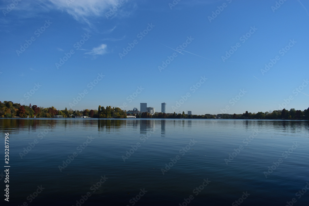 Lake and blue sky cityscape
