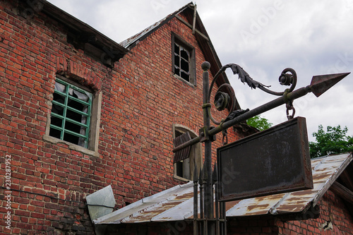 old house of red brick with pointer