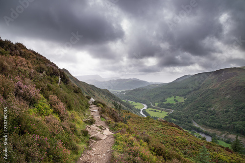 Landscape image of view from Precipice Walk in Snowdonia overlooking Barmouth and Coed-y-Brenin forest during rainy afternoon in September