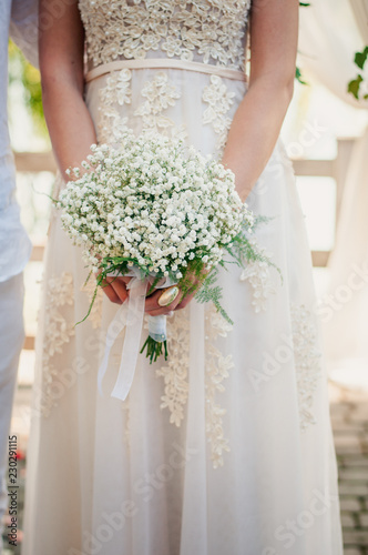 Wedding bouquet in hand of the bride