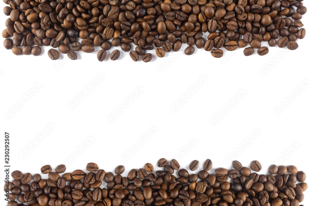 Coffee beans at border of image with copy space for text. Coffee background or texture concept. Coffee beans on white background. Top view. Coffee beans at border of image with copy space for text. Coffee background or texture concept. Coffee beans on white background. Top view.