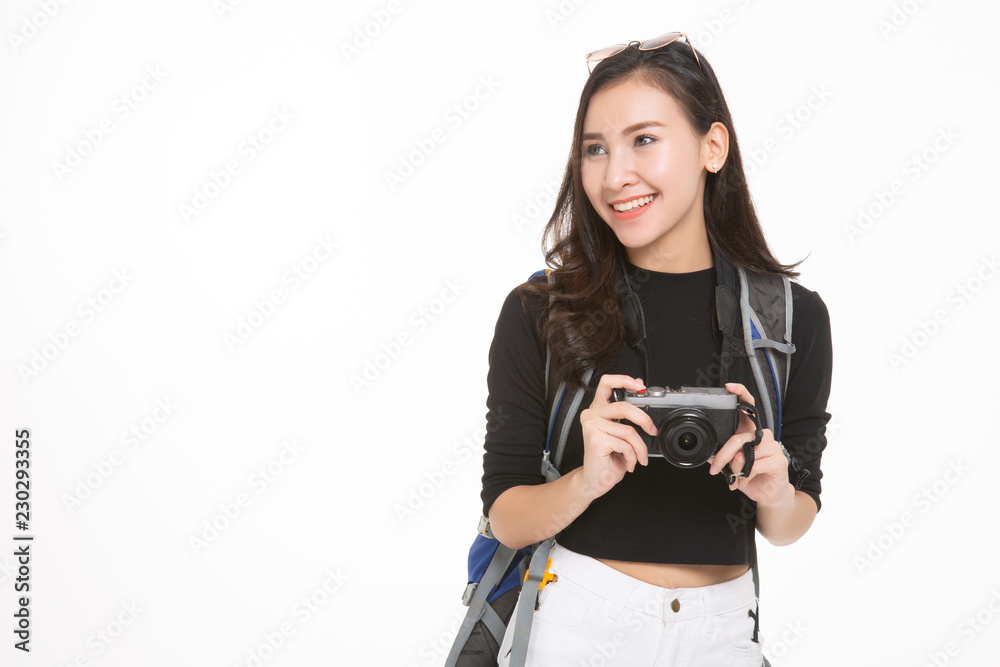 Beautiful travel girl using camera isolated on white background Beautiful travel girl using camera isolated on white background