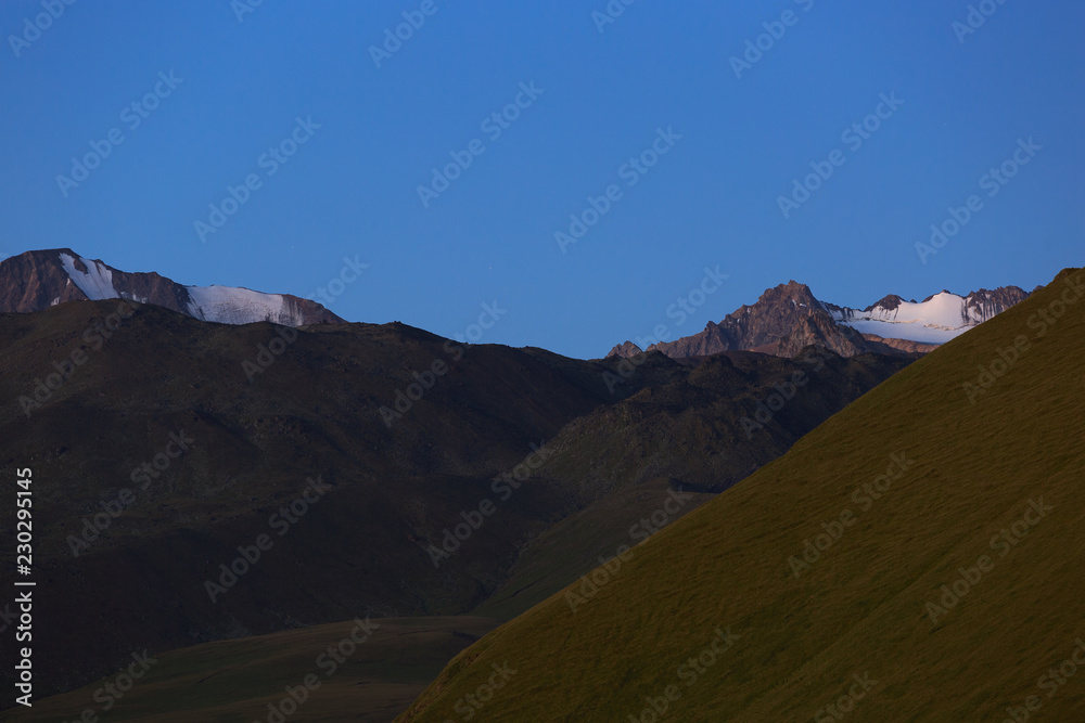 Early morning in the mountain area. Dawn over the mountains and valleys of the North Caucasus in Russia.