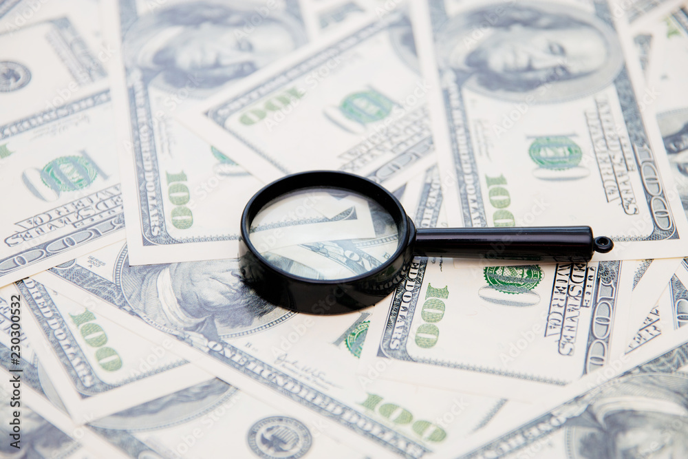 Magnifying glass on your american dollar bill as a background Magnifying glass on your american dollar bill as a background