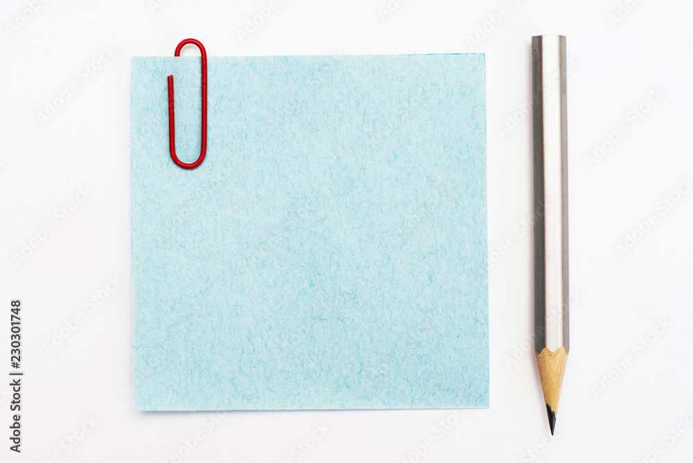 Sheet for notes and pencil on a white background