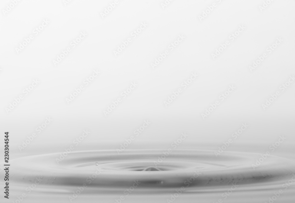 Drops of rain fall into the water, selective focus close-up Drops of rain fall into the water, selective focus close-up