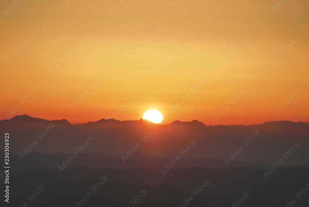 Silhouette of mountains at sunset in the evening at dusk