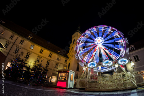 Ferris wheel on christmas fair on Mariahilferplatz in Graz Austria photo