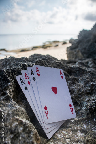 four of a kind ace poker card gamble beach theme photo