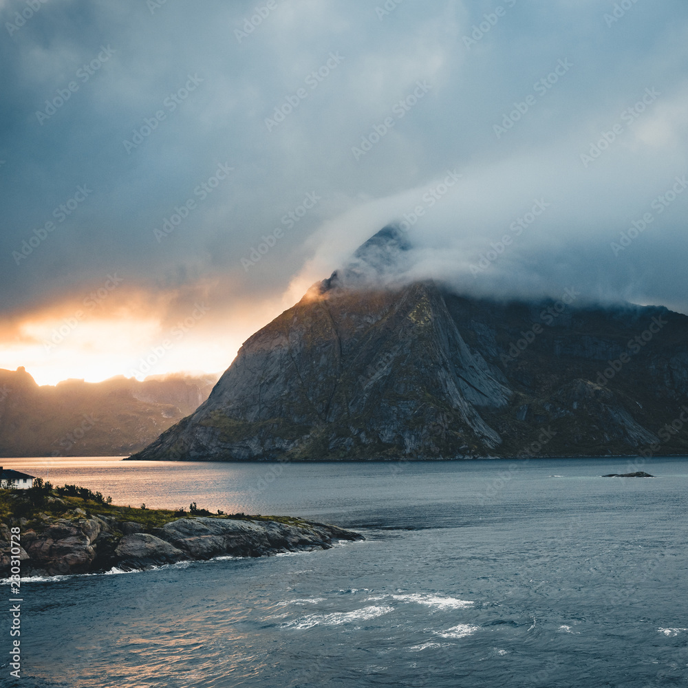 Dramatic sunset over the mountains and the sea of Lofoten islands in Norway Dramatic sunset over the mountains and the sea of Lofoten islands in Norway
