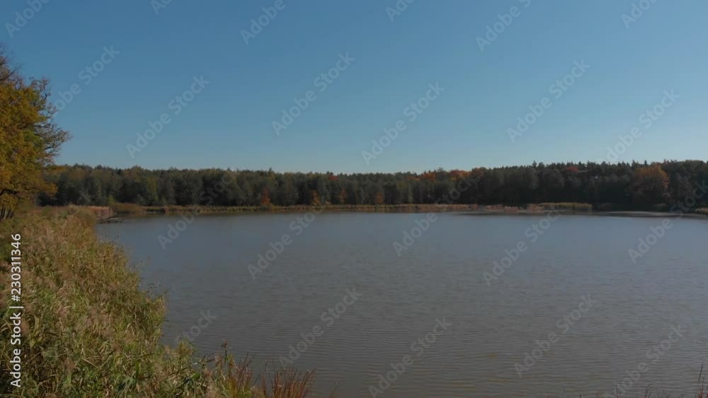 landscape with a boat on lake and blue sky landscape with a boat on lake and blue sky