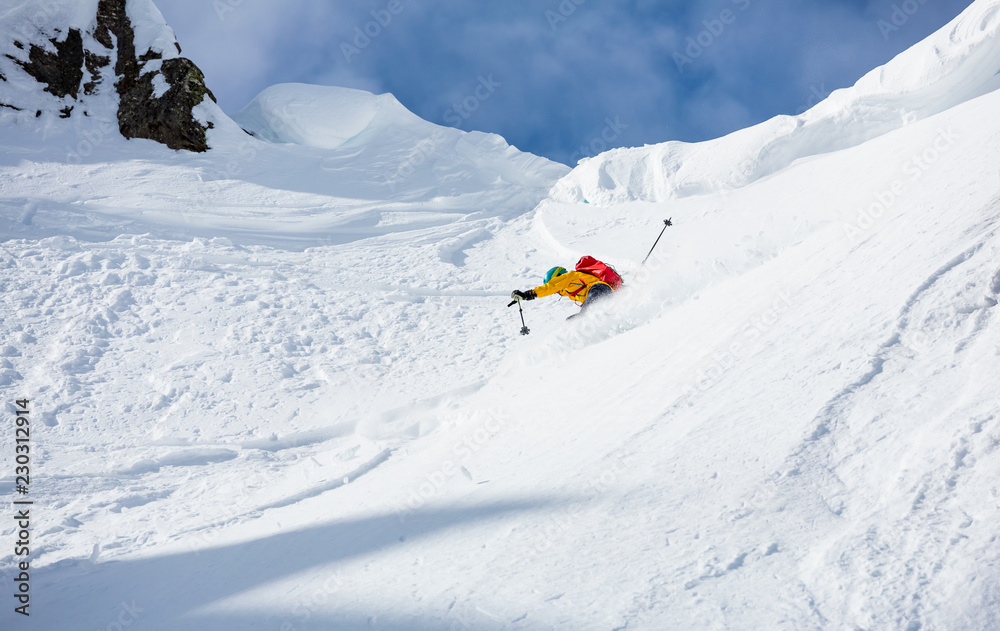 Skiing in the snowy mountains, good winter day.