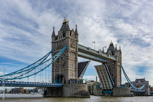 Tower Bridge on Thames river with the bridge open for ship traffic in London, UK