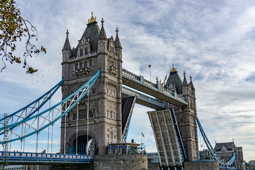 Obraz na płótnie Tower Bridge on Thames river with the bridge open for ship traffic in London, UK w salonie