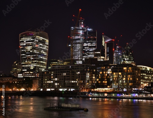 Downtown City of London along the North Bank of the Thames River at night. © michaelfitz