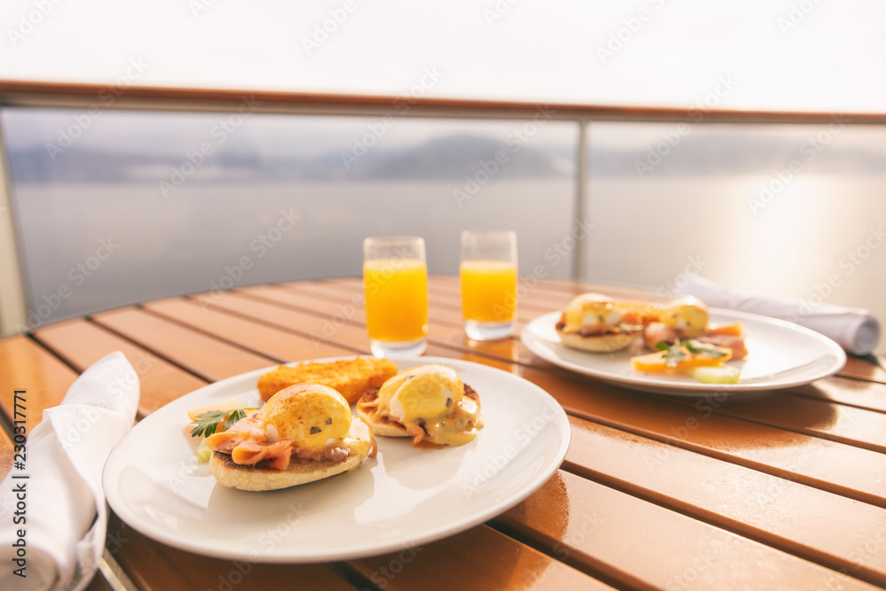 Cruise ship vacation food breakfast on suite balcony table in room service. Caribbean travel getaway, winter escape or honeymoon cruise in Europe or Santorini. Cruise ship vacation food breakfast on suite balcony table in room service. Caribbean travel getaway, winter escape or honeymoon cruise in Europe or Santorini.