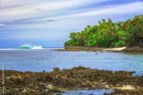 Clear blue water with corals and beautiful sky at beach for surfers Cloud9, Siargao Island, the Philippines. photo