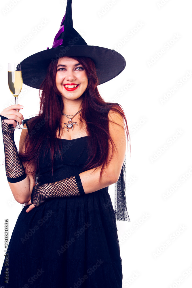 Image of happy witch with wine glass with wine in black dress and hat Image of happy witch with wine glass with wine in black dress and hat