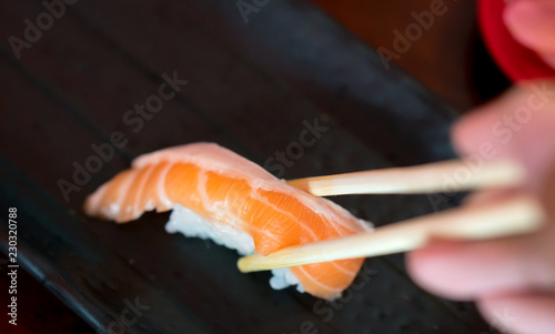 Fresh Salmon Sushi on Black Japanese plate