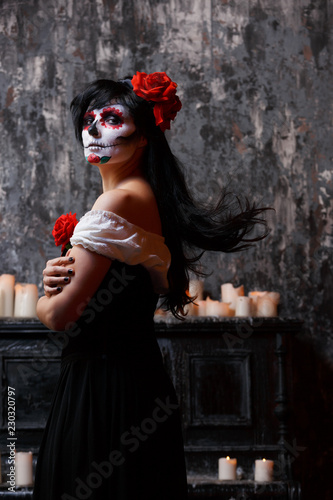 Photo of girl with white make-up and roses on face