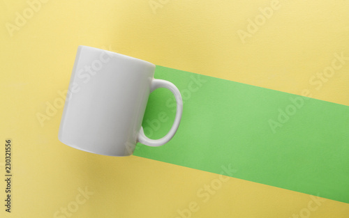 Mug green trail on yellow background - Negative space background concept